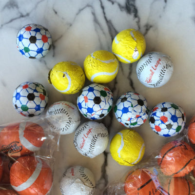 chocolate baseballs, soccer, tennis, football, basketball