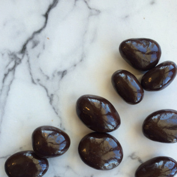 Panned dark chocolate covered cranberries