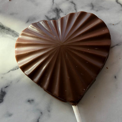 Chocolate heart pop, bold sunburst design, 1.75 oz