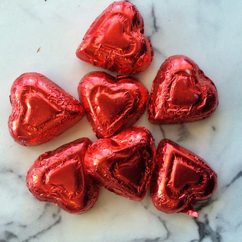 Red Foil wrapped hearts, milk chocolate, about 50 pieces per lb